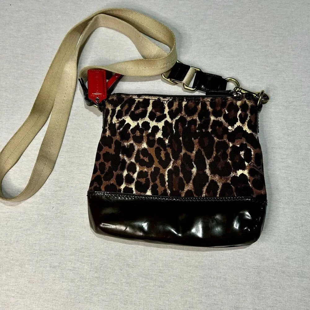 Coach Vintage Ocelot Swingpack crossbody bag with a leopard print exterior